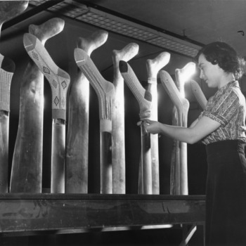 Woman boarding knit hosiery at North Carolina State College School of Textiles.