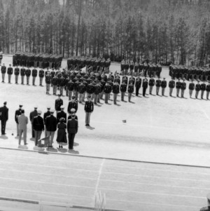 Officers and cadets standing in military formation
