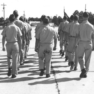 North Carolina State College ROTC cadets marching.