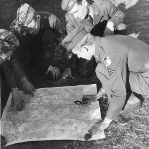 ROTC cadets studying a map