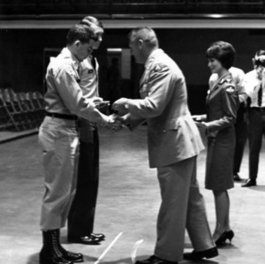 Officer presenting cadet with an award
