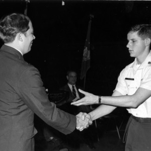 Officer presenting cadet with an award