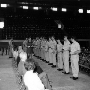 Officer presenting cadets with awards