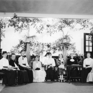 Group of women and girls in drawing room