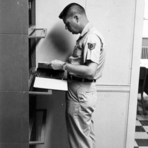 Officer checking files