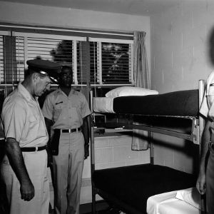 Officer inspecting cadet's bunk