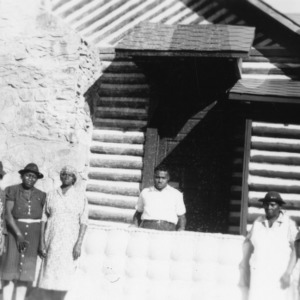 Farm women and a worker standing in front of the Person County rural center in October 1940