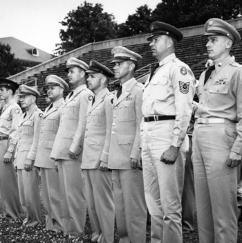 Officers standing at attention at military ceremony