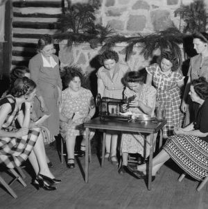Group of women watching a sewing demonstration