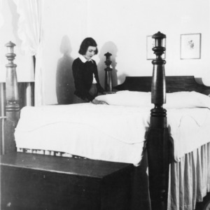 Woman making a bed