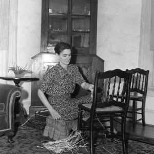 Mrs. W. D. McNairy of Greensboro, North Carolina, participating in the House Furning Project by recaning chairs