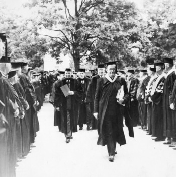 Dean Edward L. Cloyd leading academic procession for 50th anniversary celebration