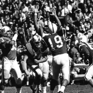 North Carolina State College quarterback Charlie Noggle passing in game against North Carolina.