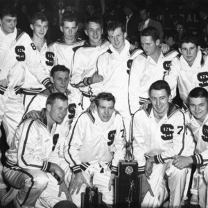 North Carolina State College's basketball team posing after winning 1950 Southern Conference Championship.