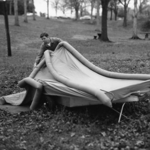 Product Design student inflating Mini-Camp tent