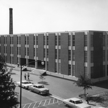 Mann Hall with smokestack in background, North Carolina State College