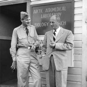 Professor Reinard Harkema with other in front of the Arctic Aeromedical Laboratory