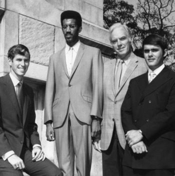 Chancellor John T. Caldwell posing with North Carolina State University student government officials, including Eric N. Moore, at Memorial Bell Tower
