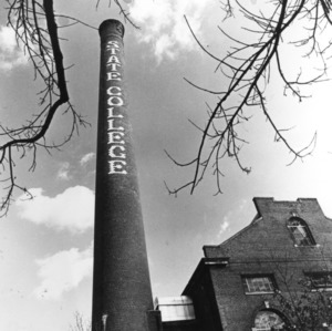 View looking up at North Carolina State College smokestack and Yarborough Steam Plant.