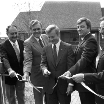 Governor James Hunt cutting the ribbon at a Solar House dedication