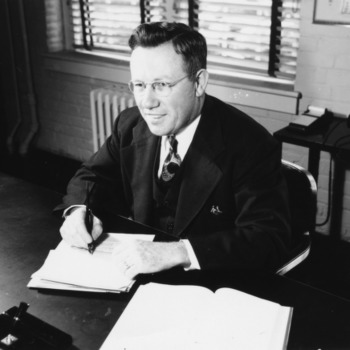 Leonard D. Baver at desk