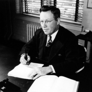 Leonard D. Baver at desk