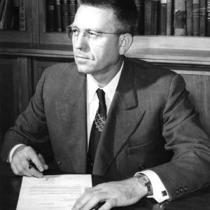 Dr. Clifford K. Beck at desk