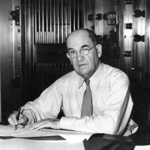 Treasurer Arthur F. Bowen at desk