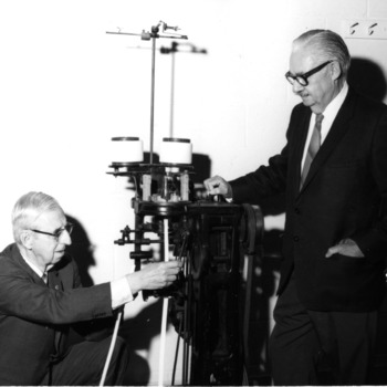 William E. Shinn and Malcolm E. Campbell inspecting knitting machine on which Shinn developed the artificial aorta [!!Duplicate!!]