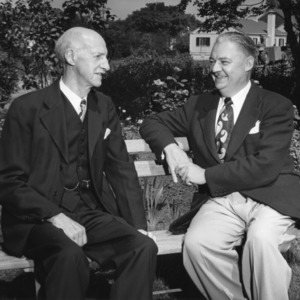 Deans Thomas Nelson and Malcolm Campbell sitting on bench