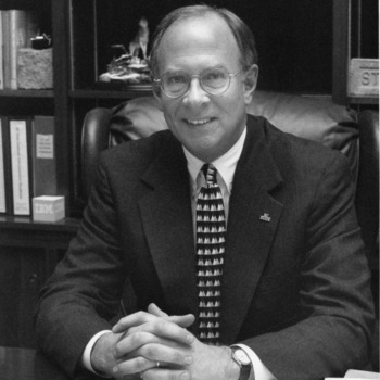 Dean James L. Oblinger at desk