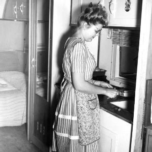 Vetville resident in home kitchen