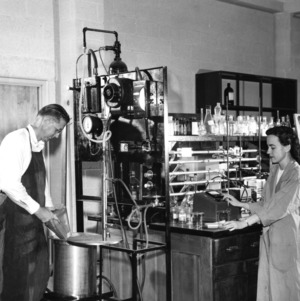 Dr. F. P. Pike and Billie Richardson working in laboratory