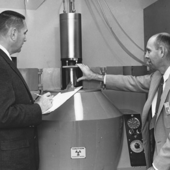 Professor Henry A. Rutherford and Dr. A. Armstrong examine the Cobalt-60 source in the College's radiological laboratory