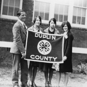 Officers of the Duplin County 4-H County Council holding a Duplin County 4-H flag