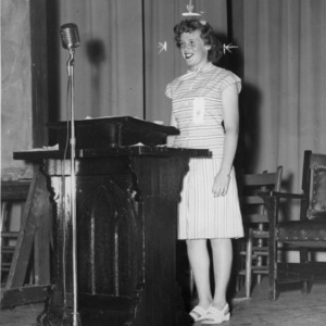 Ruth Moore, president of the North Carolina State 4-H Council in 1946, standing at a podium