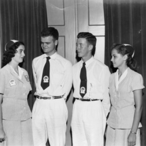 North Carolina State 4-H Council officers of 1951 look at one another