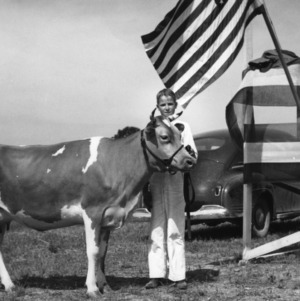 Howard Randall, Cleveland County, North Carolina, with cow, 1942