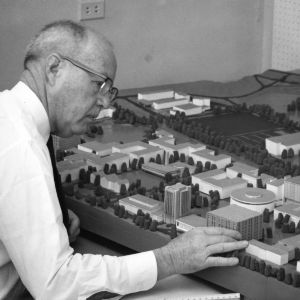 Carroll L. Mann, Jr. with model of campus