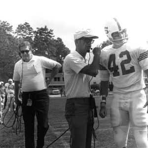 Coach Michaels talks to team captain Jack Whitley (42) during a game at UNC-Chapel Hill