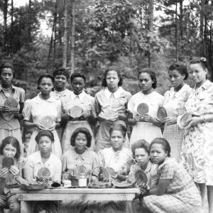 Wake County - July 14-17, 1941 Camp Whispering Pines. The 14 Club hirls exhibit their hot pan mats made from pine needles