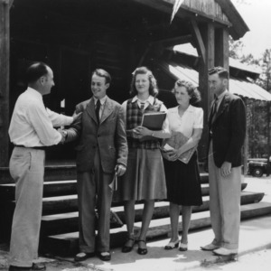 Officers of the Older Youth Conference shaking hands with L. R. Harrill (far left)