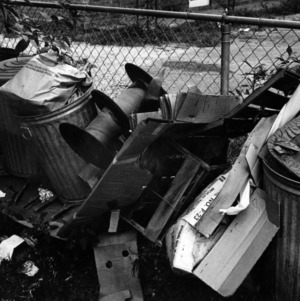 Trash cans full of trash at an inner city house in Raleigh