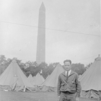L. R. Harrill with Washington Monument in background, at first National 4-H Conference, 1927