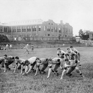 Football players lining up in offensive formation during practice, Riddick Stadium, North Carolina College of Agriculture and Mechanic Arts.
