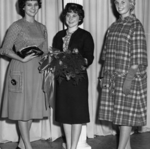 Three 4-H club members participating in the 4-H Dress Revue Contest