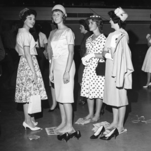 Four 4-H club members participating in the 4-H Dress Revue