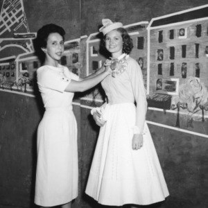 Charlotte Heinzelman (left) and unidentified girl modeling their entries in the 4-H Dress Revue