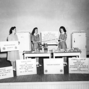 Mecklenburg County girls put on winning dairy foods demonstration in 1940 contest at 4-H Short Course, [North Carolina] State College, July 1940