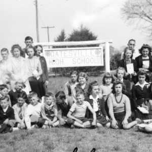 Gatesville 4-H Club posing in front of the Gatesville High School sign, the sign was a school project 1940-1941